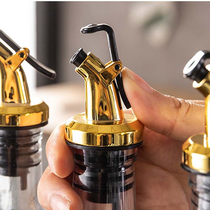 Kitchen oil bottle stopper and pourer